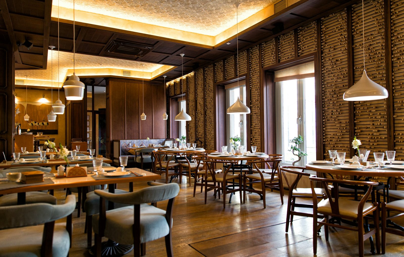 Warm restaurant dining room, where technology supports a personal guest experience